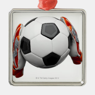 Zwei Zielwächterhandschuhe, die einen Fußball Ornament Aus Metall